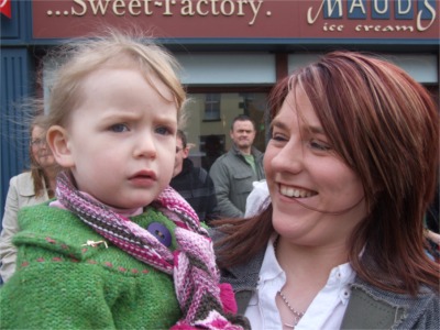Charlene Curran from Derry and daughter Leah, 2, enjoy the parade. - 0317StPats10
