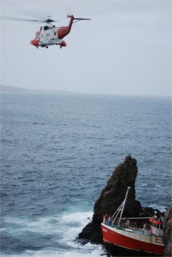 The Niamh Aine wedged on rocks in Leenan Bay. Photo courtesy George O'Hagan.