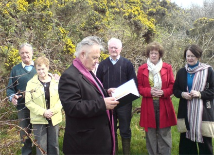 Moville parish priest, Fr Paddy O'Kane, blesses an unmarked grave site in the Tremone area. Also pictured are, from left, Dan McFeeley, Eileen Harkin, John A McLaughlin, Moira Farren and Caroline Crumlish.