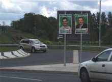 Donegal SF posters at a roundabout in Omagh.