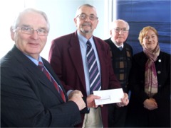 Inishowen Electoral Area chairman Cllr Bernard McGuinness presents a cheque for 10,500 euro to ICRfm's Jimmy McBride. Also pictured are Cllr Denis McGonagle and Cllr Rena Donaghy.