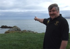 Seamus Carey points to the spot where the wreck of the plane was discovered.