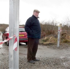 Oliver McFadden at the site of the proposed gates.