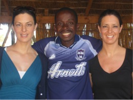 Claire, left and Emma McDermott meet a GAA fan in Lilongwe, Malawi.