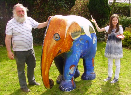 Aoife Burke helps artist Bill Griffin put the finishing touches to her Elephant Parade entry.