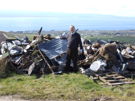 Cllr Martin Farren at the site of the fly-tipping in Greencastle.