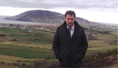 Cllr Charlie McConalogue overlooking part of the Urris and Dunaff area that has recently been connected to wireless internet.