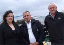 The Braemar's Captain Nelson, centre, is greeted by Jacqueline Doherty, marketing officer, Derry City Council and Bill McCann, Derry harbour master.