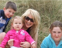 Michael, Aileen, baby Susie and Anna at Culdaff beach.